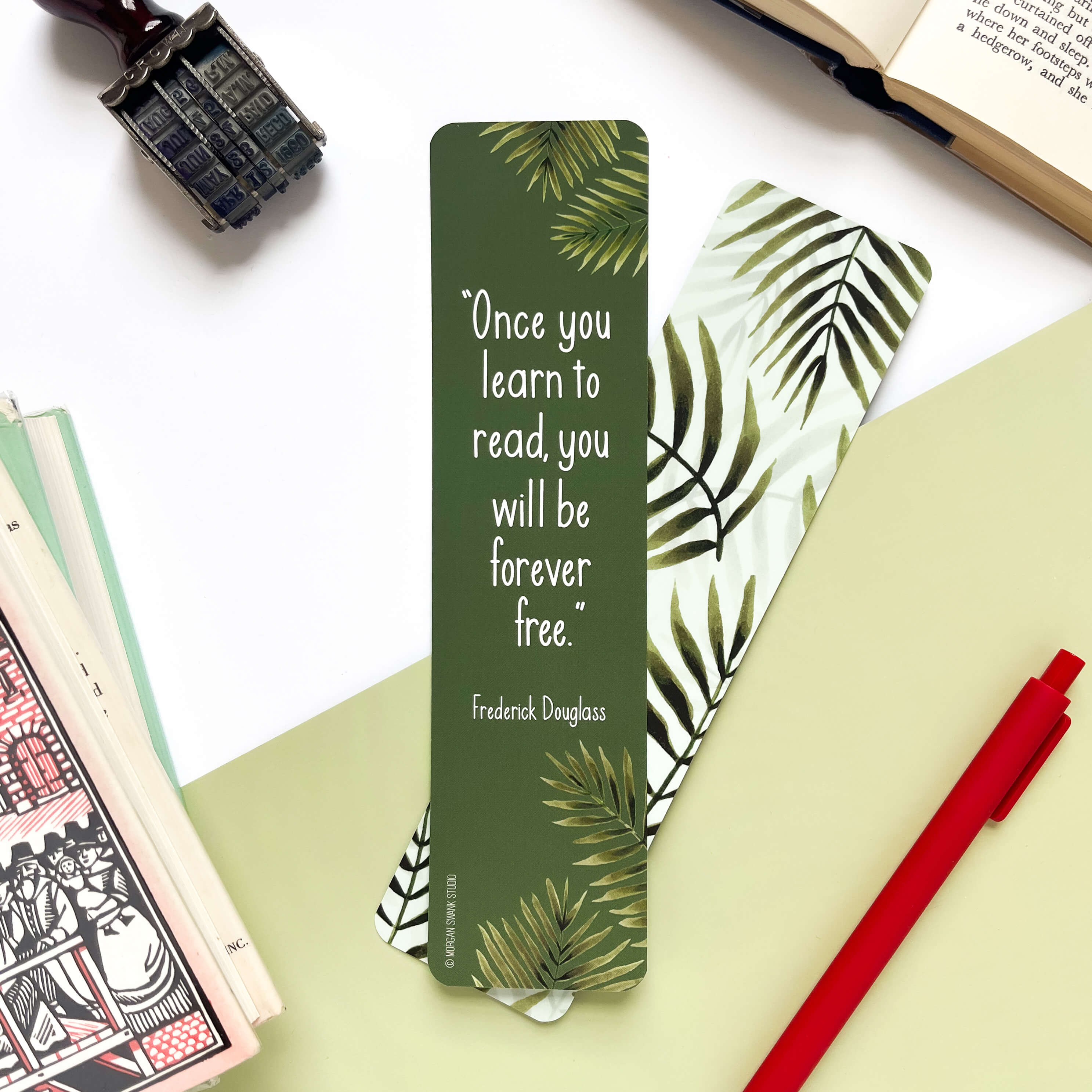 Bookmark with green palm leaves and quote by Frederick Douglass