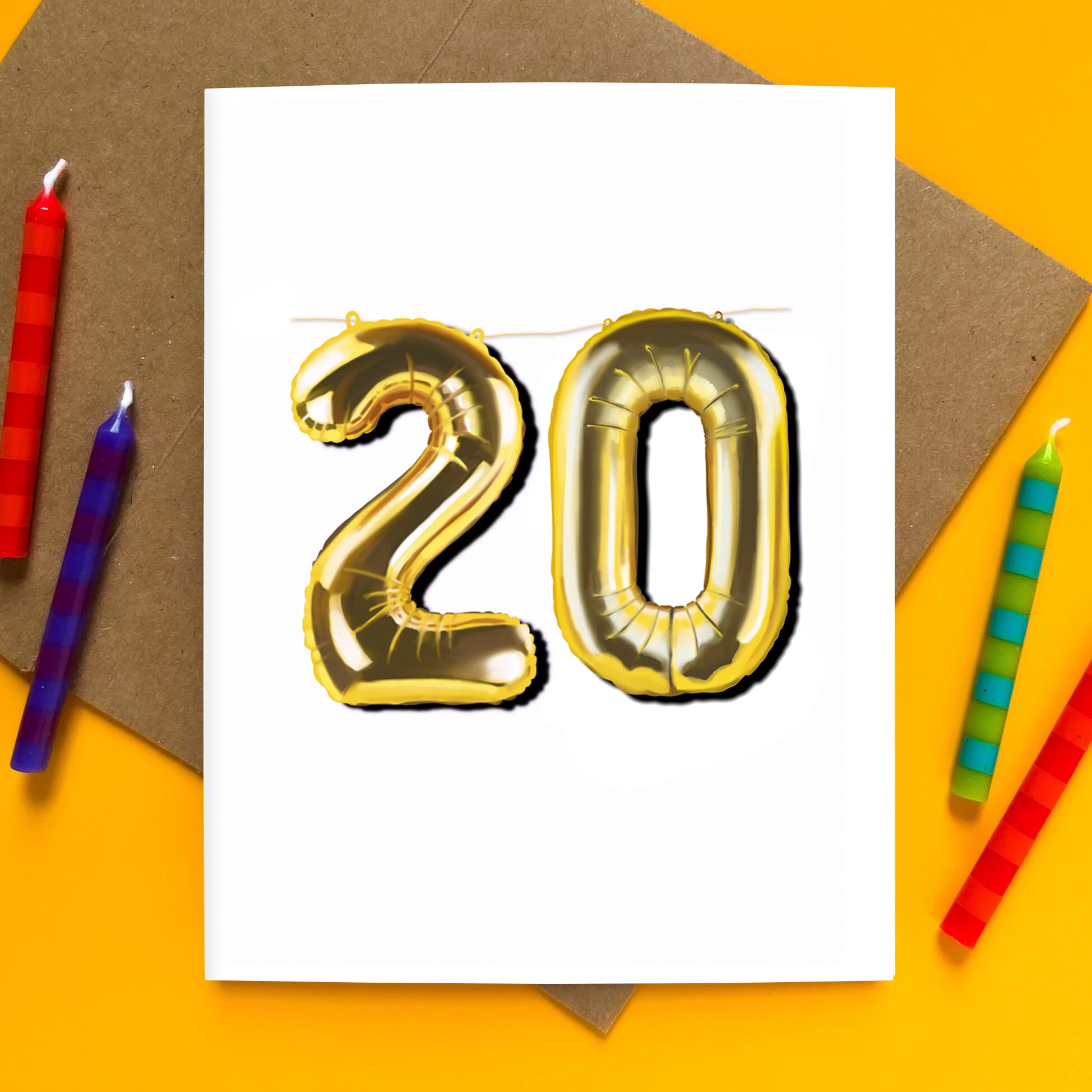 Greeting card with gold balloon numbers forming “20” hanging from a string.