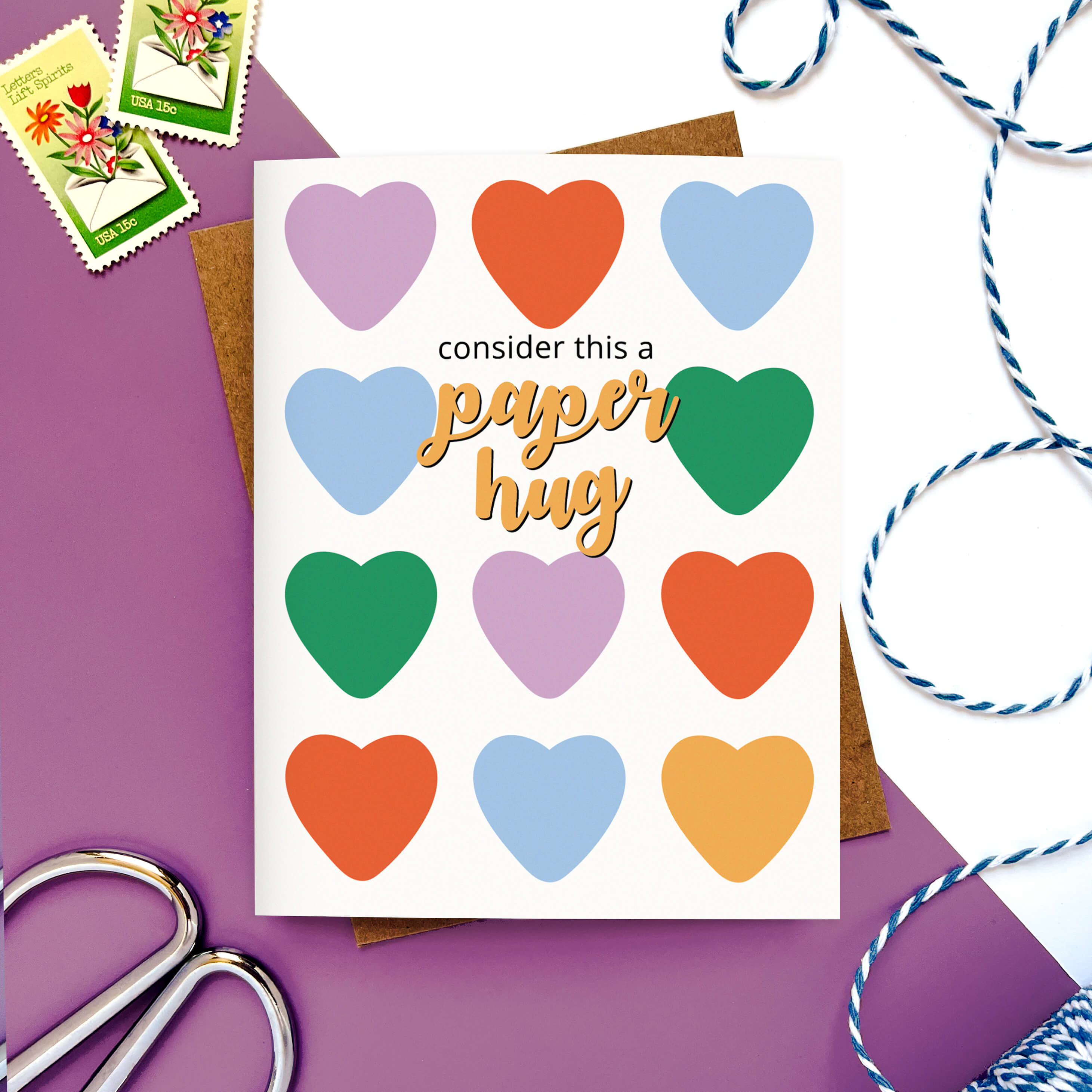 Greeting card with multicolored hearts and the phrase “Consider this a paper hug.”