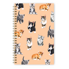 Notebook with watercolor kittens on a light peach background.
