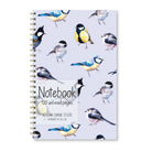 Notebook with bird illustrations on a pale blue background.