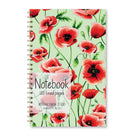 Notebook with red poppy flower illustrations on a light green background.