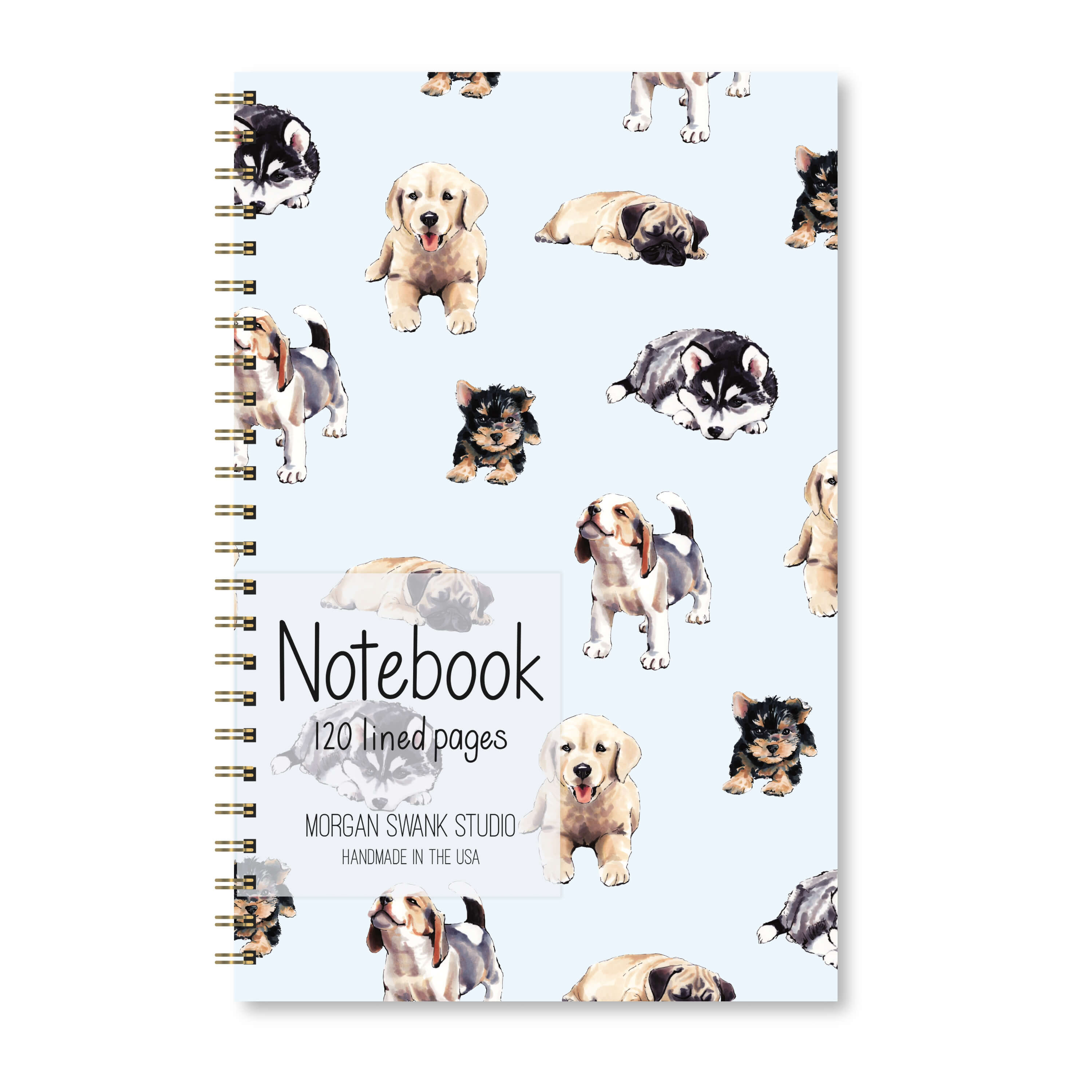 Notebook with illustrated puppies on a pale blue background.