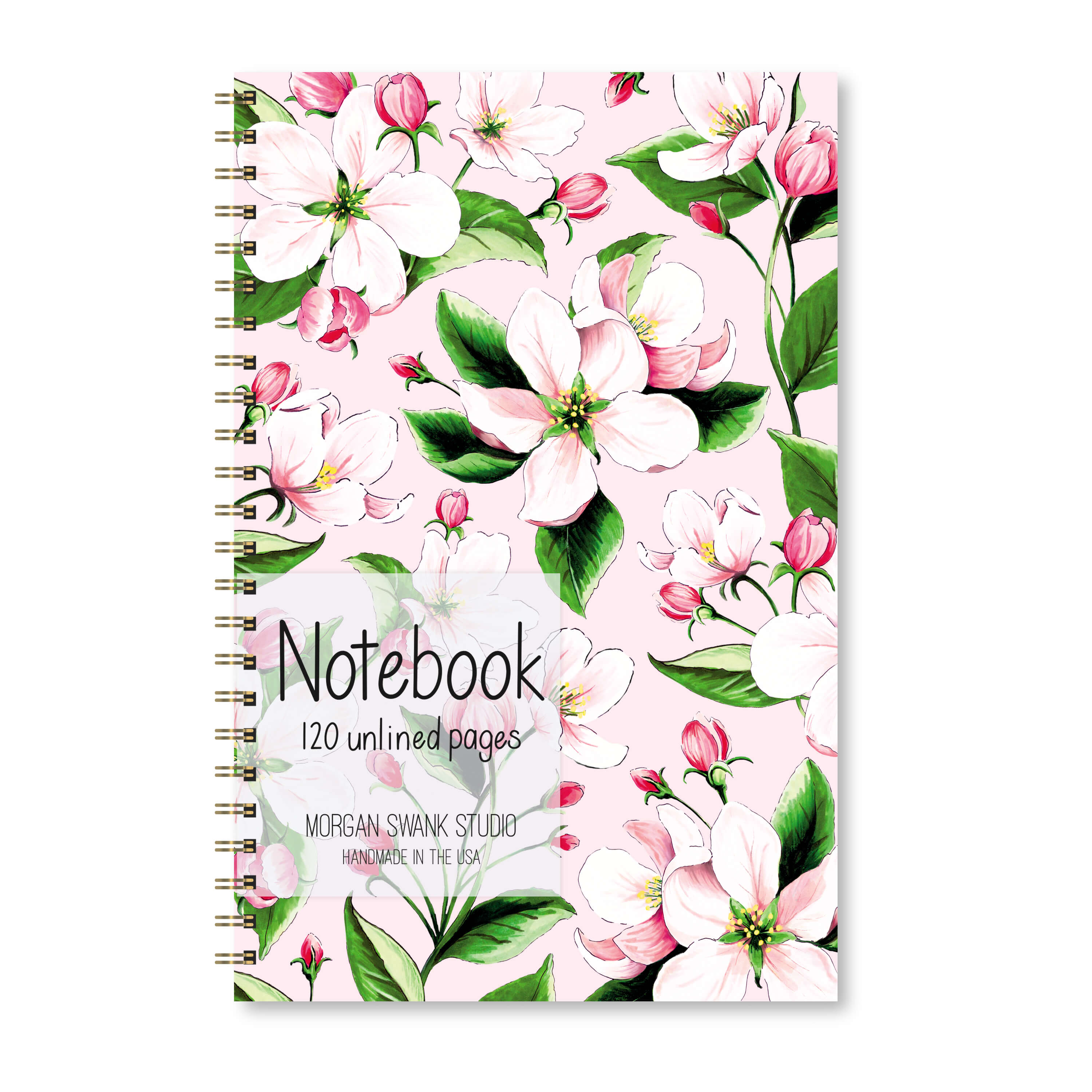 Notebook with pink apple blossom illustrations on a blush background.