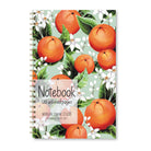 Notebook with orange fruit and white orange blossoms on a green background.