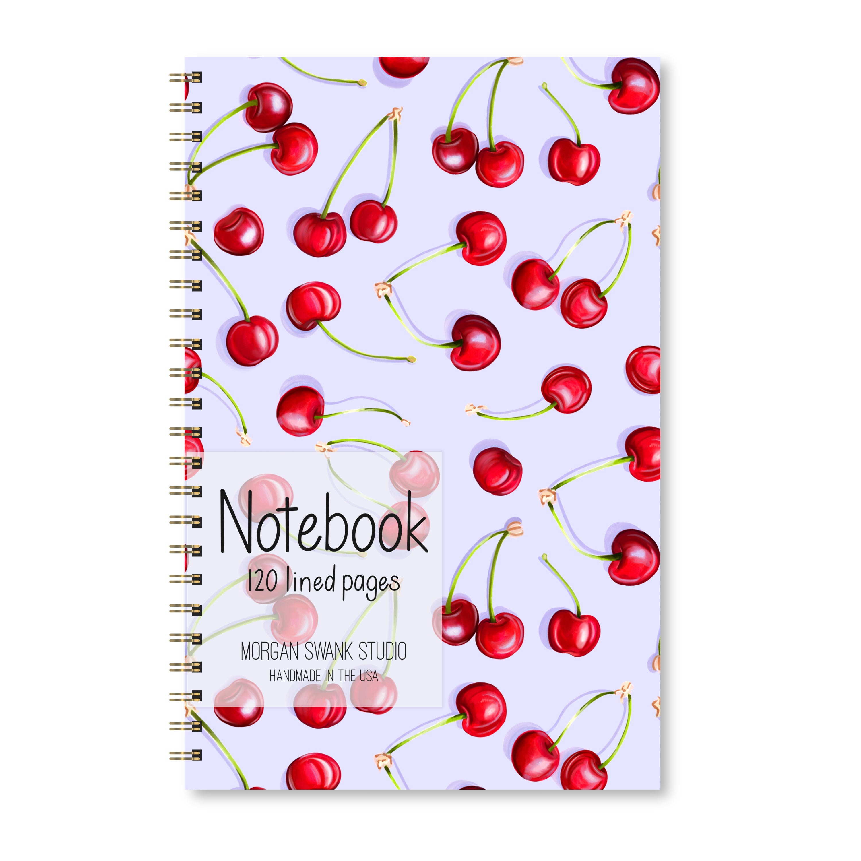 Notebook with bright red cherry illustrations on a light purple background.