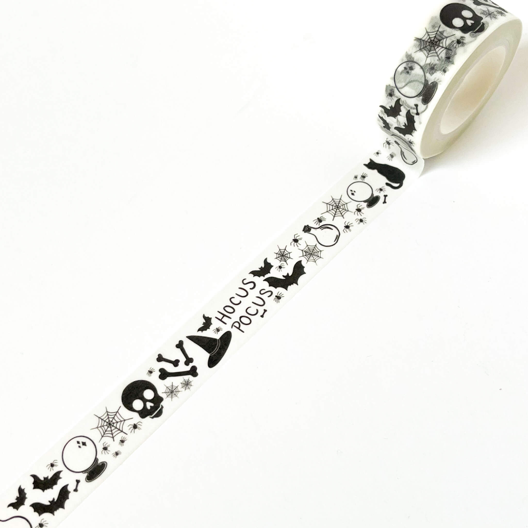 White washi tape with black Halloween illustrations and text 'Hocus Pocus'