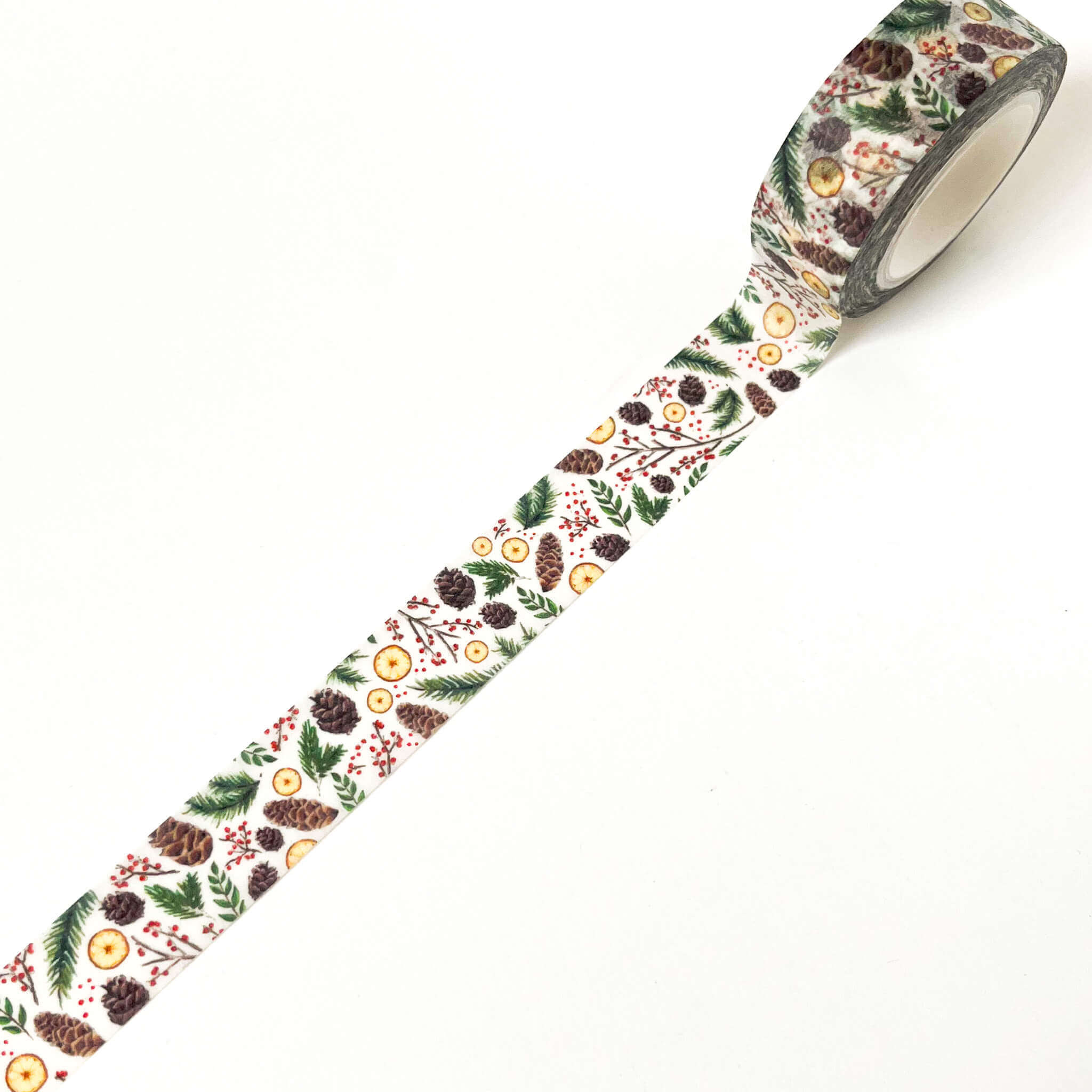 White washi tape with illustrations of pinecones, greenery, and orange slices