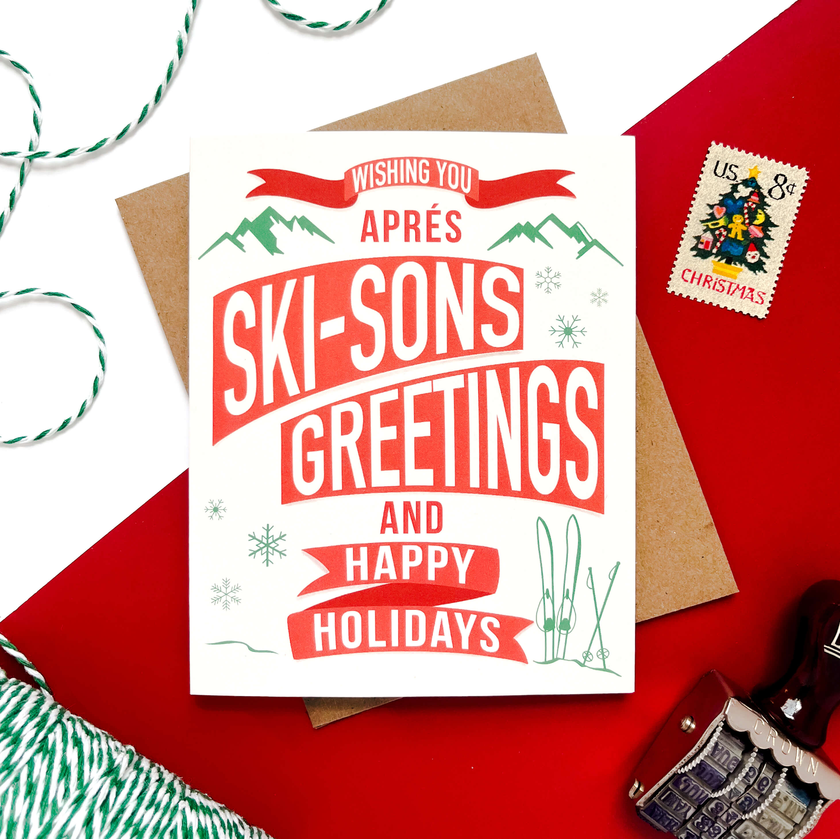 Holiday card with retro typography reading “Apres Ski-sons Greetings and Happy Holidays.”