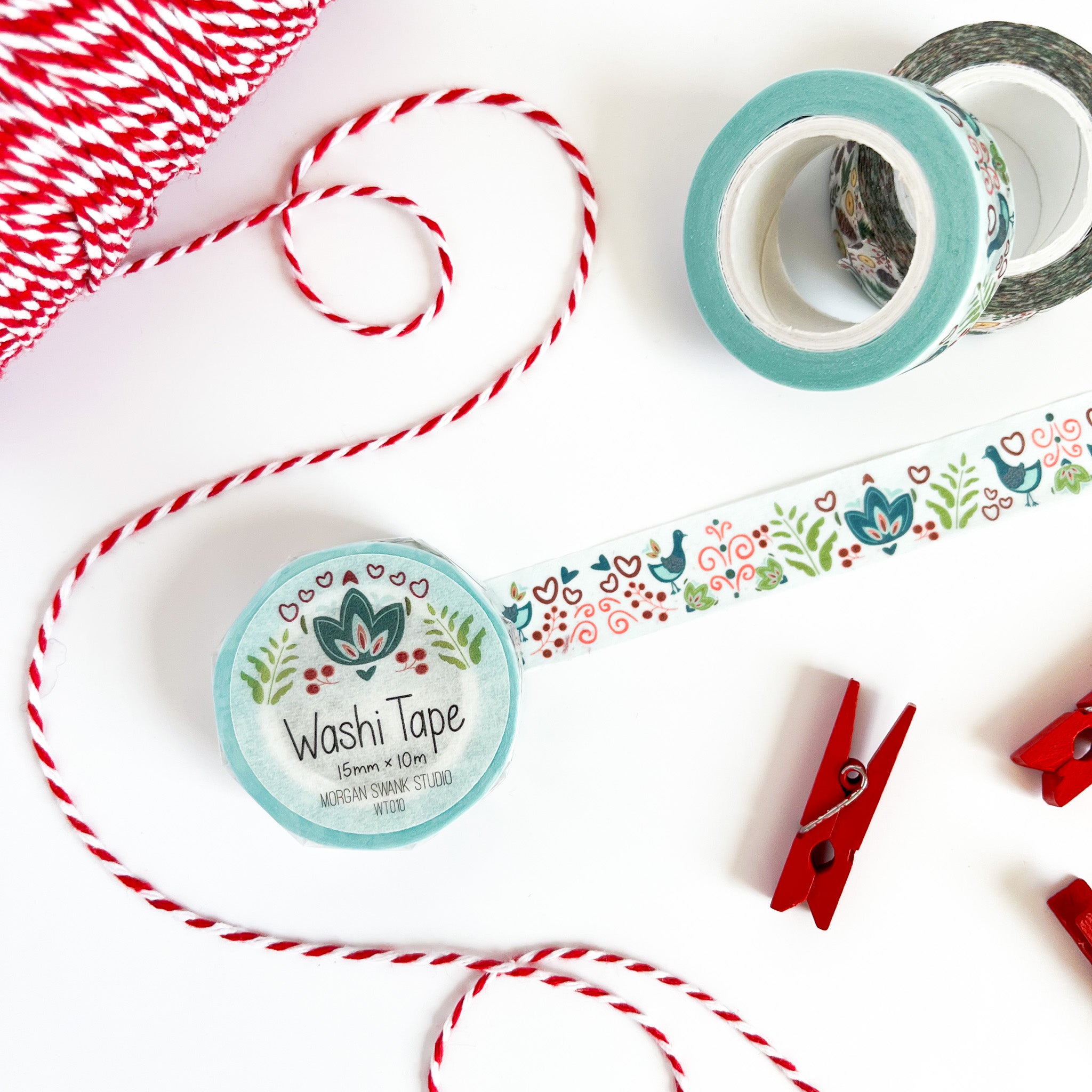 Light blue washi tape with teal folk art birds, hearts, and florals