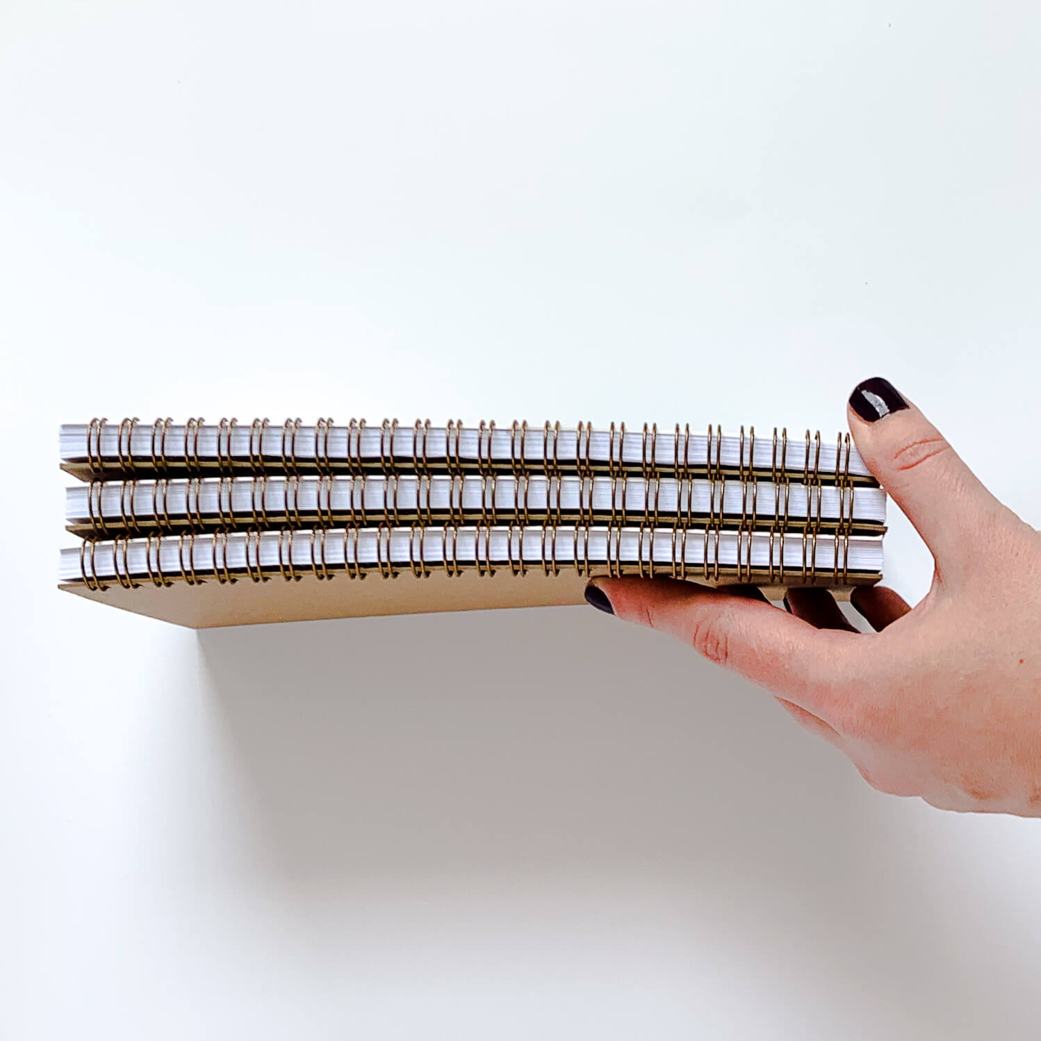 Side image of notebooks showing spiral binding and width