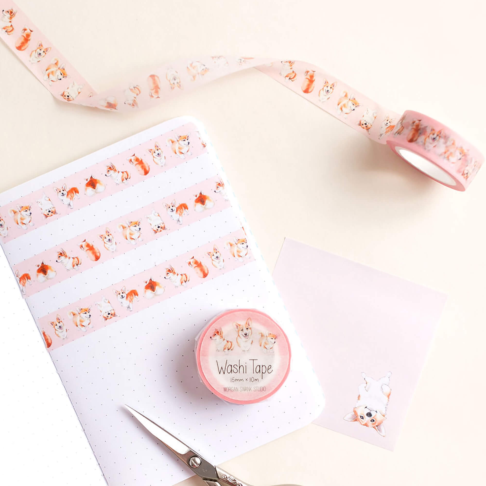 Pink washi tape with illustrated pembroke welsh corgis in various poses
