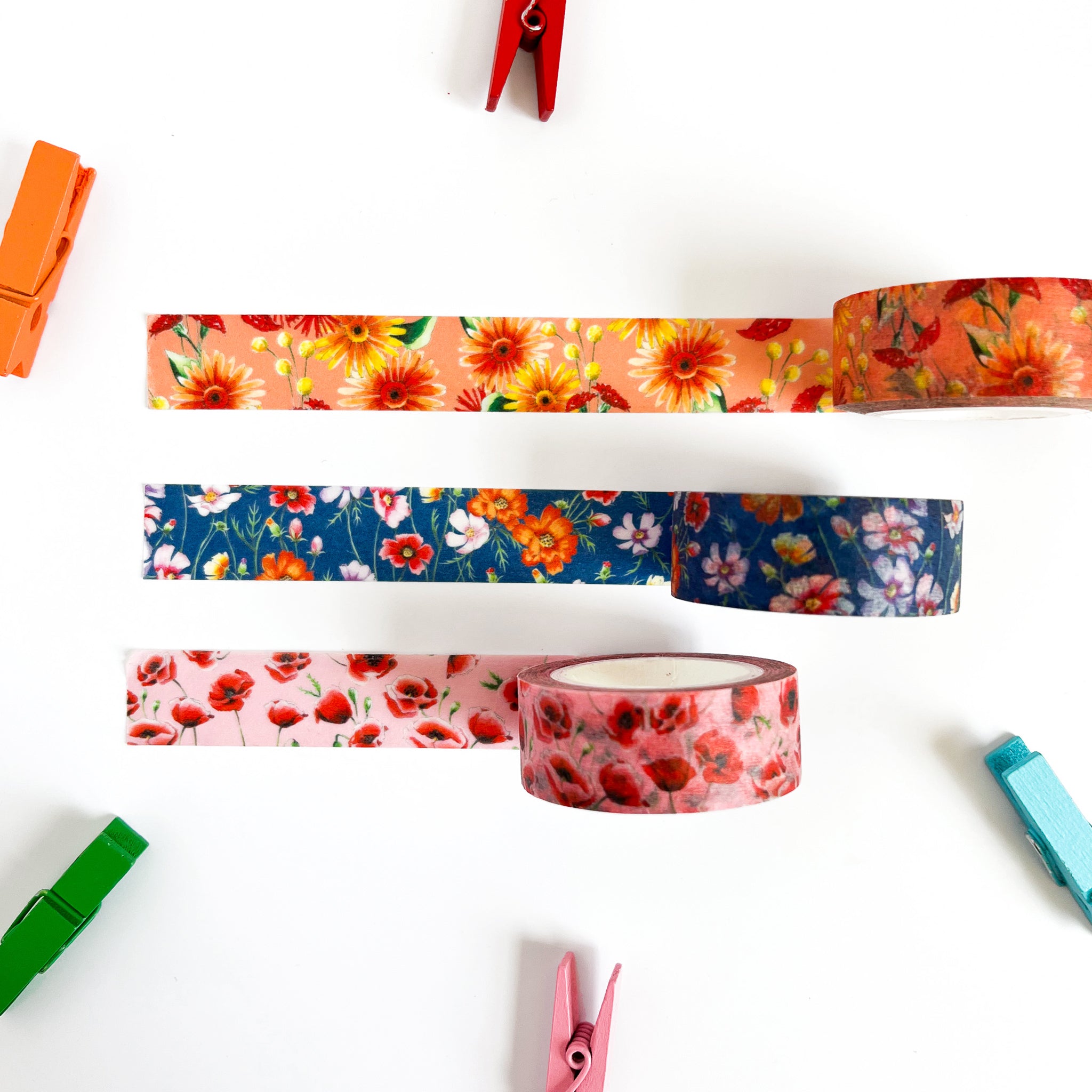 Orange washi tape with yellow and red gerbera daisy illustrations