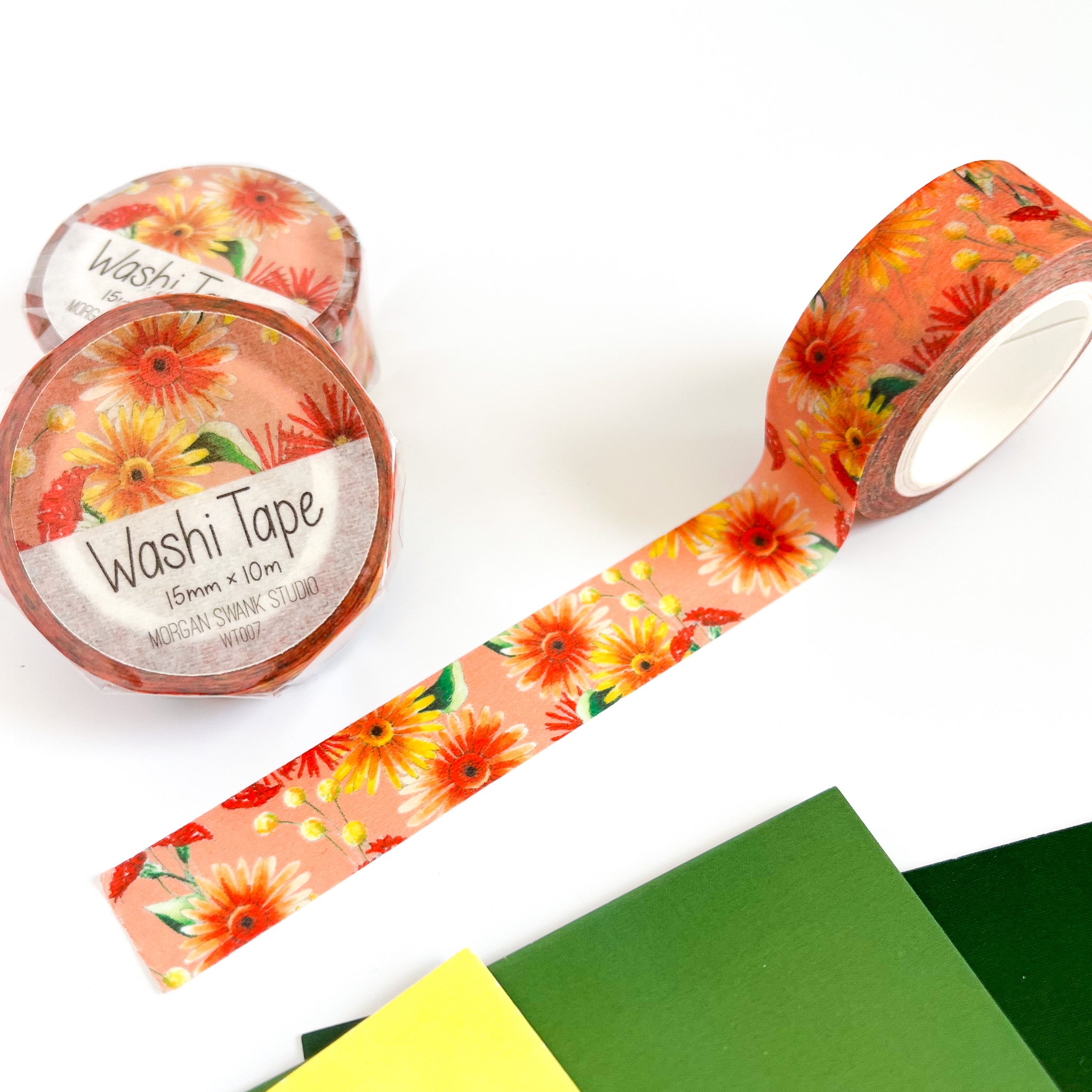 Orange washi tape with yellow and red gerbera daisy illustrations