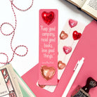 Bookmark with heart-shaped balloons and quote by Louisa May Alcott