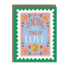 Greeting card with a vintage-inspired postage stamp design featuring flowers and "Sending You Tons of Love" message.