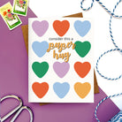 Greeting card with multicolored hearts and the phrase “Consider this a paper hug.”