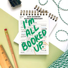Handmade mini notebook with vintage library card design and green “I’m All Booked Up” lettering