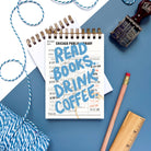 Plastic-free mini notebook with vintage library card design and blue “Read Books Drink Coffee” text
