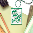 “I’m All Booked Up” green waterproof sticker with vintage library card design